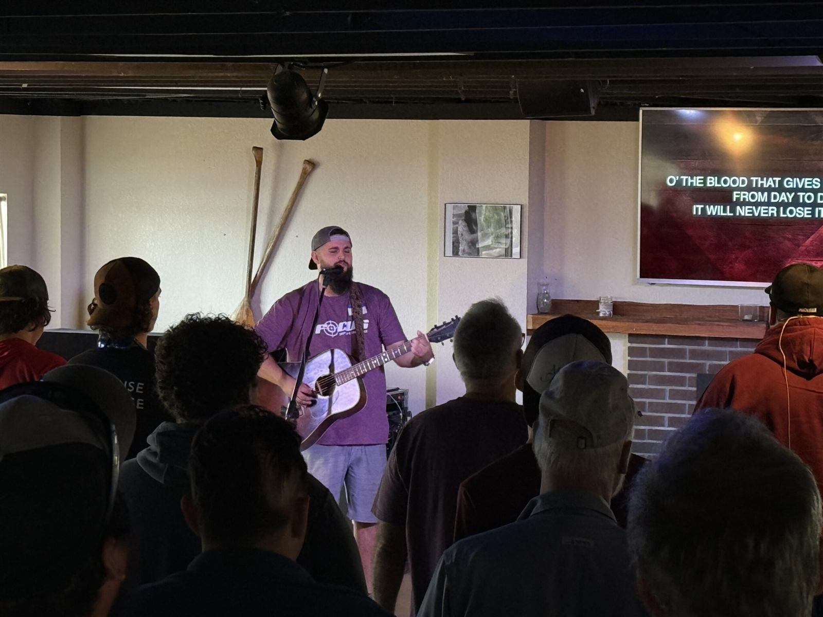 Men gathering for worship and teaching at FOCUS